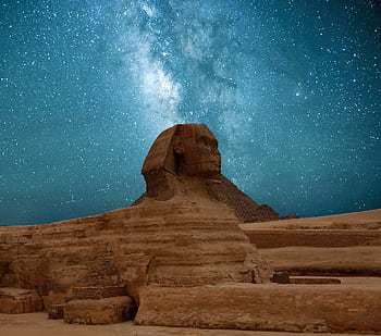 The Great Sphinx of Giza beneath a captivating Milky Way night sky. HD wallpaper
