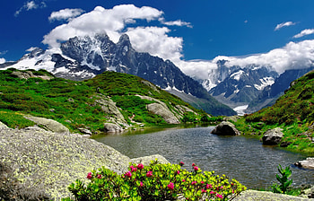 Mountain river, river, peaks, nice, shore, reflection, greenery, slopes, beautiful, grass, rocks, lake, stones, mountain, pretty, clouds, nature, sky, flowers, lovely, stream HD wallpaper