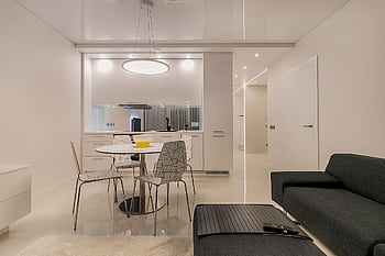 Stylish contemporary open-plan living room and kitchen with minimalist design in Vilnius. HD wallpaper