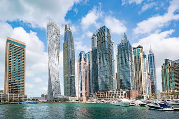 Stunning view of Dubai Marina's iconic skyline with high-rise skyscrapers and calm waterfront. HD wallpaper