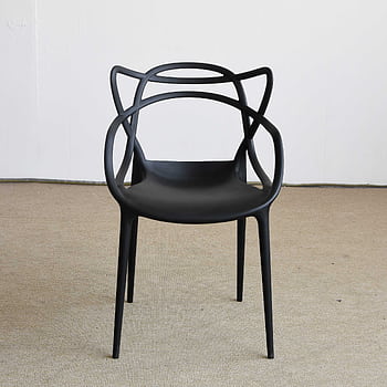 Stylish black designer chair with unique shape, perfect for modern interiors. HD phone wallpaper