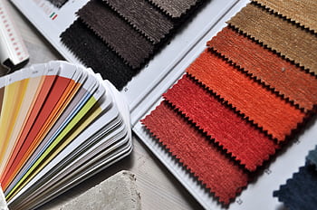 Close-up of fabric swatches and color palette, ideal for interior design and textile projects. HD wallpaper