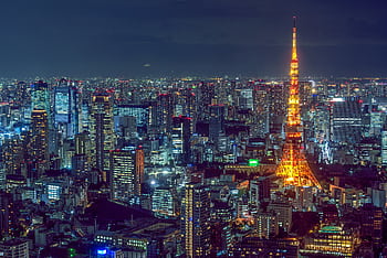Stunning aerial view of Tokyo's vibrant cityscape with the illuminated Tokyo Tower at night. HD wallpaper