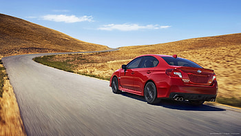 2015 Red Subaru WRX STI Rolling Shot HD wallpaper