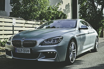 Sleek BMW sedan parked outdoors in Hamina, Finland, showcasing luxury automotive design. HD wallpaper