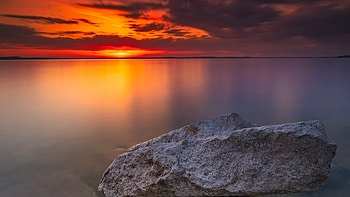 Gray Rocks Near Body Of Water , sunset, rocks, nature HD wallpaper