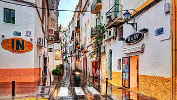 side street in Ibiza on a rainy day, side, rain, town, motorcycle, street HD wallpaper