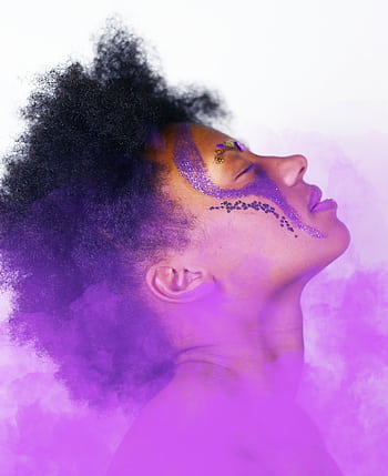 Artistic side profile of a woman with face paint and purple smoke, symbolizing creativity. HD phone wallpaper