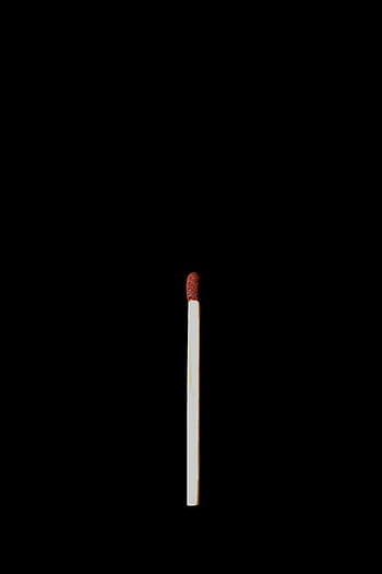A single matchstick against a black background, emphasizing simplicity and contrast. HD phone wallpaper