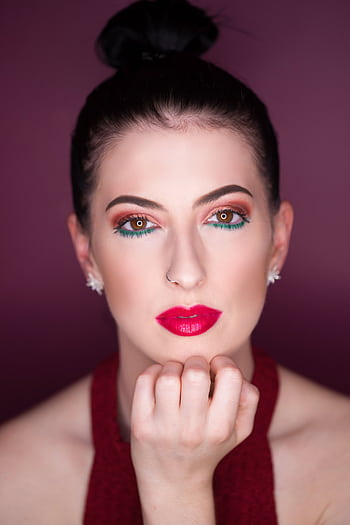 Stunning portrait of a woman with striking makeup featuring red lips and expressive eyes. HD phone wallpaper