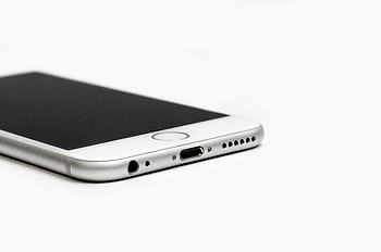 Minimalist of a sleek smart with focus on the bottom edge and ports. HD wallpaper