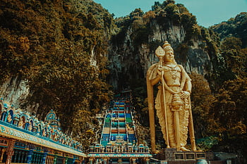 Majestic statue of Lord Murugan at Batu Caves, a famous tourist destination in Malaysia. HD wallpaper