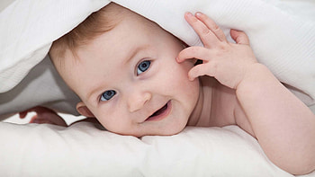 Grey Eyes Cute Baby Toddler Is Lying Down On Bed Under White Cloth Cute HD wallpaper