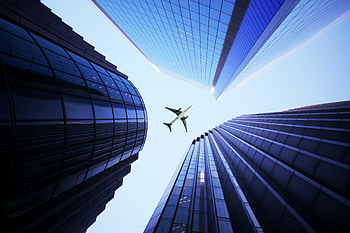 Buildings' blue facade, airplane HD wallpaper