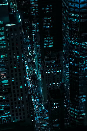 Captivating aerial view of illuminated skyscrapers in New York City during the night. HD phone wallpaper