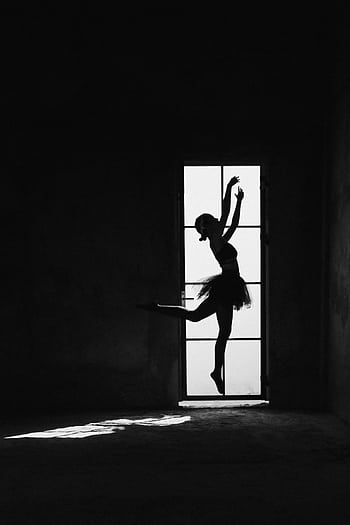 A graceful ballerina silhouette performing a ballet pose in front of a window, full of elegance. HD phone wallpaper