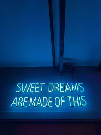 Illuminated neon sign reading 'Sweet Dreams Are Made of This' in blue lighting. HD phone wallpaper
