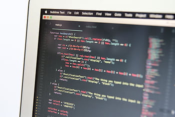 Close-up showing JavaScript code on a computer screen, reflecting modern programming work. HD wallpaper