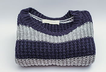 Warm knitted sweater with blue and white stripes, perfect for winter fashion. HD wallpaper