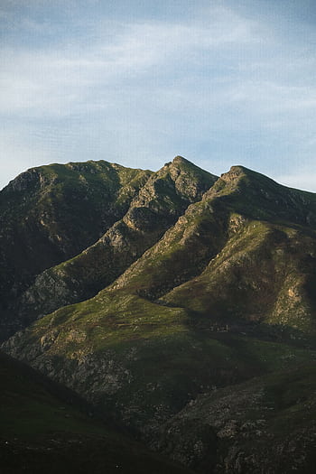 Serene view of a lush mountain range at sunrise in Knysna, South Africa. HD phone wallpaper