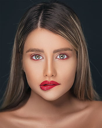 Elegant portrait showcasing a woman's beauty with striking makeup and deep gaze. HD phone wallpaper