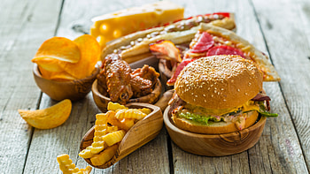 Burger artistry, Crispy lettuce garnish, Handheld delight, Irresistible temptation HD wallpaper