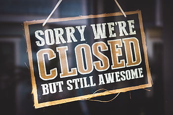 A playful closed sign on a shop door reading 'Sorry We're Closed But Still Awesome'. HD wallpaper