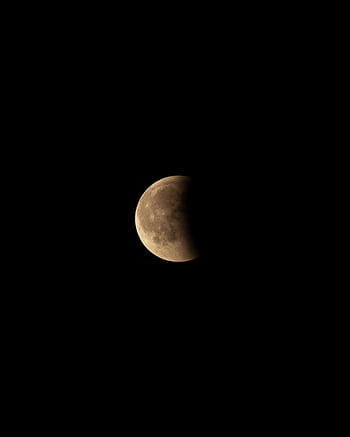 Half moon during a lunar eclipse with clear sky background, perfect for night sky enthusiasts. HD phone wallpaper