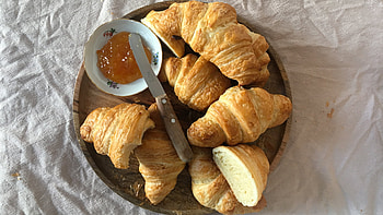 Homemade croissants, Flaky pastry layers, French baking tradition, Culinary delight HD wallpaper