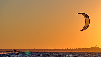Kiteboarding at sunset, Serene backdrop, Colorful kites, Twilight beauty HD wallpaper