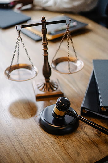 A striking featuring a brass justice scale and gavel on a wooden desk, symbolizing law and justice. HD phone wallpaper