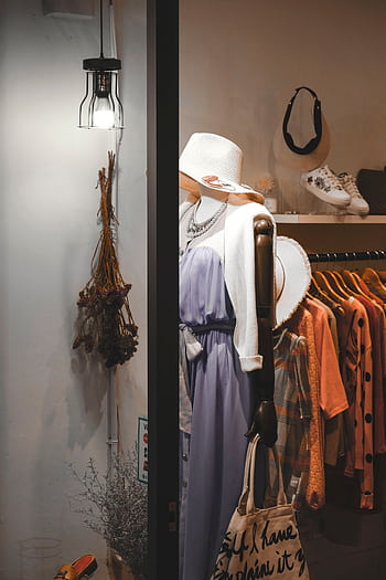 Stylish mannequin showcasing elegant apparel at a fashion boutique in Taipei. HD phone wallpaper