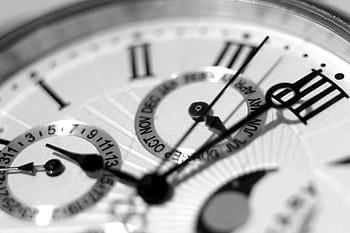 Detailed black and white shot of an elegant watch face showcasing timekeeping elements. HD wallpaper