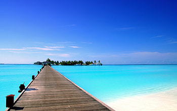 Paradise, island, blue, boat, tropical, pier, peaceful, beauty, beach, boats, trees, dock, ocean, sea, exotic, beautiful, summer, view, clouds, nature, sky, lovely HD wallpaper