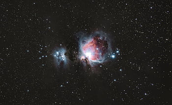 A breathtaking graph of the Orion Nebula amidst a starry night sky, capturing celestial beauty. HD wallpaper