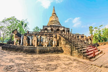 Ancient ruins of Wat Chang Lom temple at Si Satchanalai Historical Park, Thailand, showcasing historical architecture. HD wallpaper