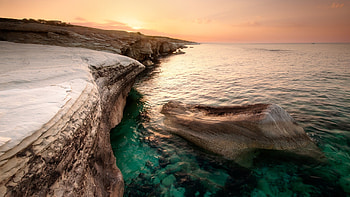 Cyprus coast sea, Rock and sunset, Beach view, Serene atmosphere HD wallpaper