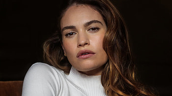 Lily James Girl Model Is Wearing White Dress Sitting In Dark Background Girls HD wallpaper