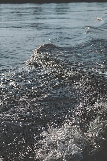 Captivating ocean waves under soft daylight, perfect for a calming coastal theme. HD phone wallpaper