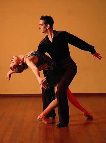An elegant ballroom dance performance showcasing passion, skill, and grace. HD phone wallpaper