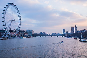 Scenic evening view of the London Eye and Big Ben along the River Thames. HD wallpaper