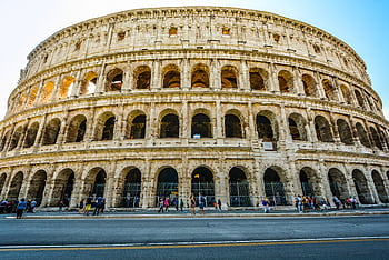 Explore the majestic Colosseum in Rome, Italy, a symbol of ancient Roman engineering. HD wallpaper