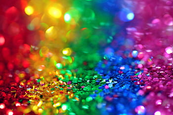 Colorful bokeh effect with vibrant rainbow glitter, perfect for festive backgrounds. HD wallpaper