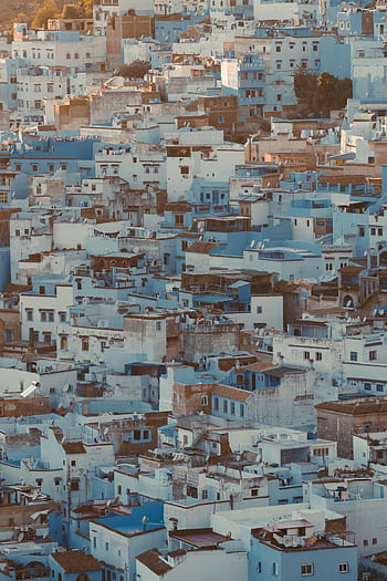 A stunning aerial view of the iconic blue buildings in Chefchaouen, Morocco. HD phone wallpaper