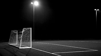 Sports football field night light, Soccer's allure, Grayscale beauty, Goalpost drama HD wallpaper