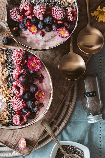 Delicious smoothie bowls topped with fresh berries, perfect for a healthy breakfast. HD phone wallpaper
