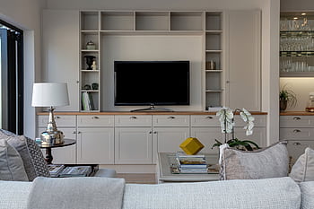 Stylish contemporary living room featuring elegant furniture and decor, perfect for home interiors. HD wallpaper