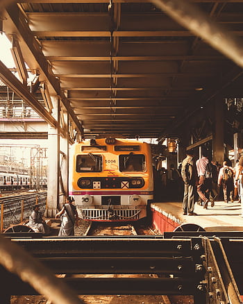 Passenger train at a bustling Mumbai railway platform during the day. HD phone wallpaper