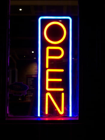 Illuminated neon sign displaying 'OPEN' with vibrant colors at night. HD phone wallpaper