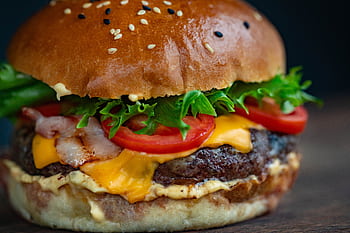 Juicy cheeseburger with bacon, lettuce, tomato, and sesame seed bun. HD wallpaper